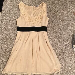 Formal Cream Sleeveless Dress with Black Accent